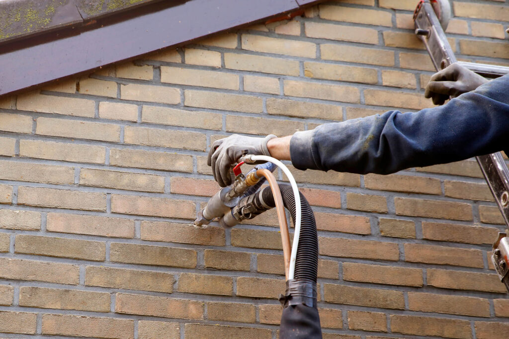 Assessing cavity wall insulation on brick wall of a house